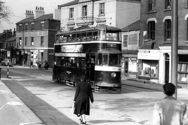 North Street showing Feltham tram no.559, on route 3 to Harehills. On the right is Levin & Levin, woollen merchants, at no.100 North Street, then Bernard Rose, tailor, at no.102. Hidden behind the tram is the North Tavern then following the junction with Darley Street is the Fashion Pleating Co. Ltd. Pictured in 