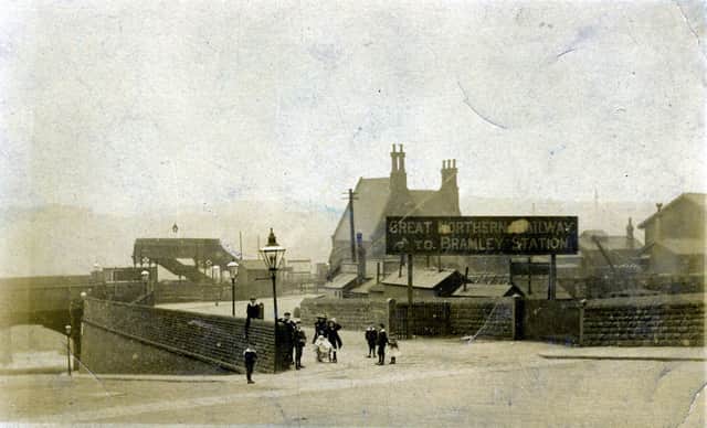 The entrance to Bramley Railway Station on Stanningley Road circa 1908. A sign reads 'Great Northern Railway to Bramley Station'. The station opened on 1st August 1854 and had two platforms opposite each other accessed by the footbridge seen here. The station closed on 2nd July 1966 eventually to be replaced by a new one which opened on 12th September 1983. 