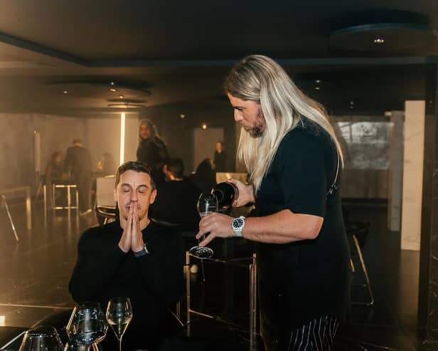 Michael O'Hare serves Gary Neville at the launch of his new Leeds restaurant Psycho Sandbar (Photo by Simmy Khande)
