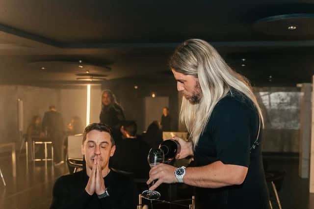 Michael O'Hare serves Gary Neville at the launch of his new Leeds restaurant Psycho Sandbar (Photo by Simmy Khande)