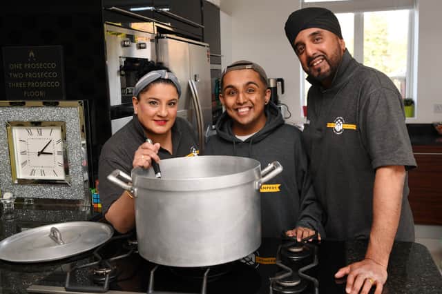 Aky and Tina Suryavansi, pictured with son Akash, run the Homeless Hampers charity in Leeds which helps to feed hundreds in need each week and has just received the King's Award for Voluntary Service. Photo: Jonathan Gawthorpe.