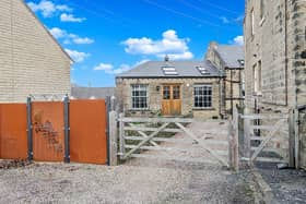 This former industrial glass company converted into a semi-detached home is on the market.
