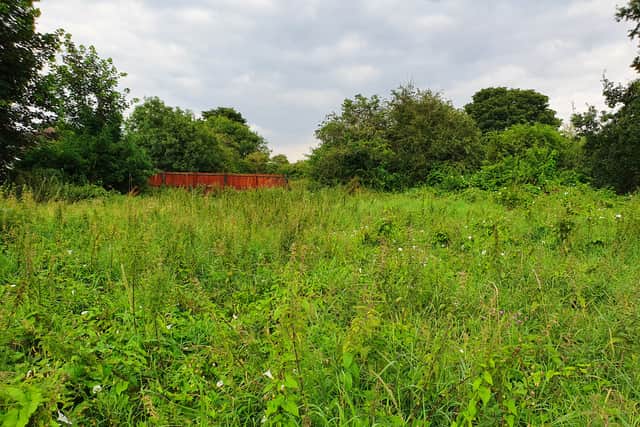 The plot of land in Seacroft before the group got together to turn it into a community garden.
