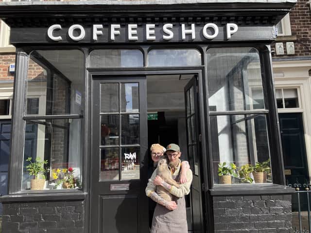 Raw Coffee, Mill Hill, opened to the public on March 20. Pictured are the owners, husband and wife Anya Adams and James Adams with their dog. 