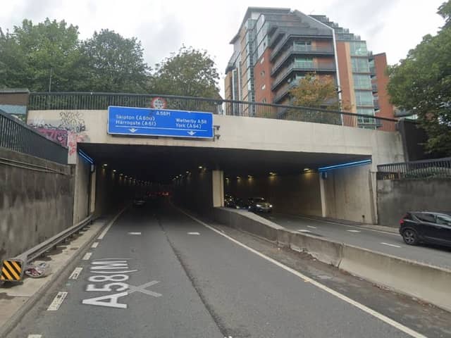 The A58 was closed in both directions after a man was stood on the wrong side of the Great George Street footbridge.