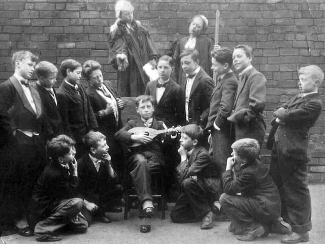 Pupils of St. Luke's School taking part in a production of Gilbert and Sullivan's comic opera Trial by Jury in April 1926. Standing fourth from the right is Jim Wheeler but no other names are known.