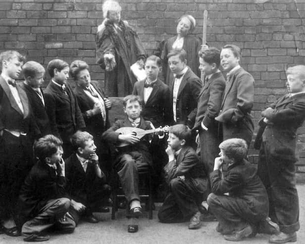 Pupils of St. Luke's School taking part in a production of Gilbert and Sullivan's comic opera Trial by Jury in April 1926. Standing fourth from the right is Jim Wheeler but no other names are known.