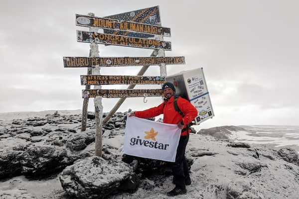 Michael Copeland from Stafford, on his climb up Kilimanjaro with a fridge on his back. The former soldier has conquered Africa's highest mountain whilst carrying a fridge on his back to encourage men to talk about mental health with MIND.