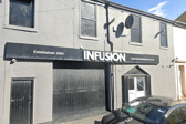 A woman who broke her neck diving into a pool at Infusion Blackpool Swingers Club is suing NWAS and hospital trust for £10m