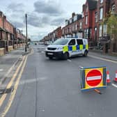 Police on Tempest Road, Beeston, where a woman's body was found. A man has been arrested on suspicion of her murder. (Photo by Steve Riding)