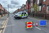 Police on Tempest Road, Beeston, where a woman's body was found. A man has been arrested on suspicion of her murder. (Photo by Steve Riding)