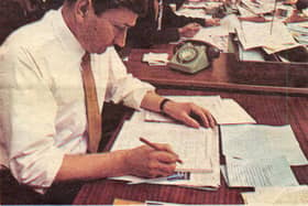 Leslie Parkin, pictured drawing up a page for the newspaper.