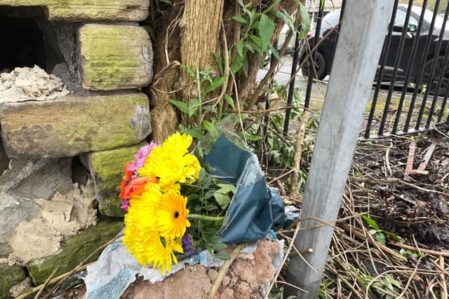 Flowers at the scene in Bradford city centre where a young woman was stabbed to death in the street