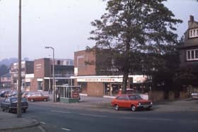 Meanwood Shopping Centre situated on Green Road, with Malcolm’s Bargain Stores prominent. A bus shelter is seen in front. Pictured in 1977.