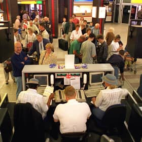 Leaving on a jet plane. Holidaymakers check-in for a flight to Palma in June 1996.