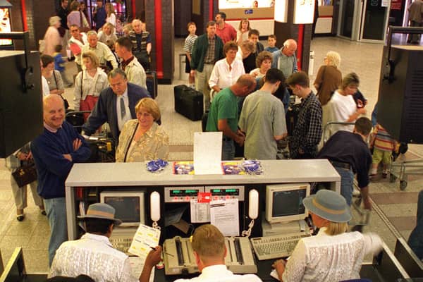 Leaving on a jet plane. Holidaymakers check-in for a flight to Palma in June 1996.