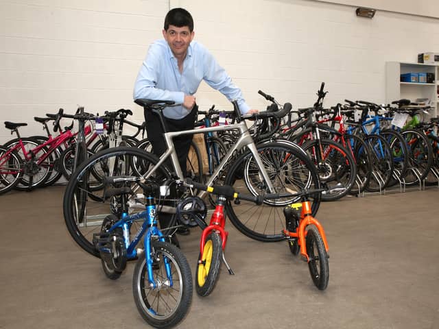 Auctioneer Paul Cooper with some of the high-value bikes that went under the hammer on Tuesday.