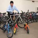 Auctioneer Paul Cooper with some of the high-value bikes going under the hammer.
