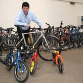 Auctioneer Paul Cooper with some of the high-value bikes that went under the hammer on Tuesday.