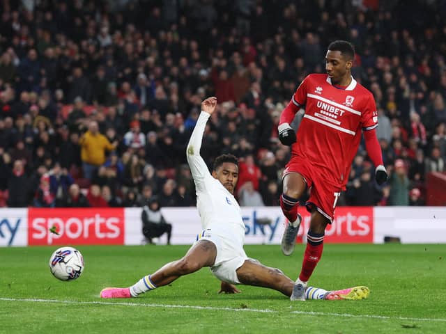BATTLING ON: Leeds United left back Junior Firpo, left, in Monday night's 4-3 win at Middlesbrough.