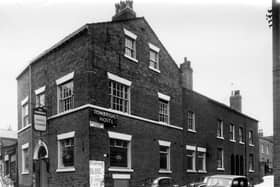 The Tonbridge Hotel, public house located at the corner of Tonbridge Street, left, and Back Blundell Street. The beer was supplied by Inde Coope and Allsop Brewery. A poster on the wall informs that the Empire Theatre, Leeds has closed for the summer. To the right (not in this view) and opposite the pub was the Leeds Dental School.