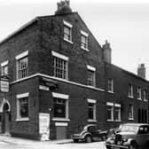The Tonbridge Hotel, public house located at the corner of Tonbridge Street, left, and Back Blundell Street. The beer was supplied by Inde Coope and Allsop Brewery. A poster on the wall informs that the Empire Theatre, Leeds has closed for the summer. To the right (not in this view) and opposite the pub was the Leeds Dental School.