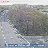 A woman has been brought to safety after she was spotted on the wrong side of the railings on a bridge over the M621. Photo: motorwaycameras.co.uk.