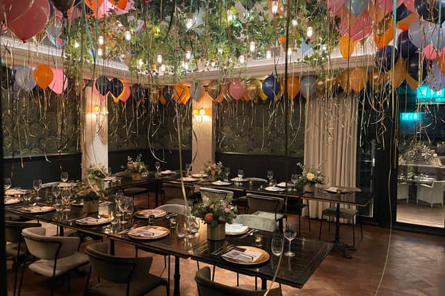 The opulent private dining room had been filled with balloons. Photo: National World.