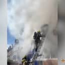 Firefighter rescues man from burning flat.