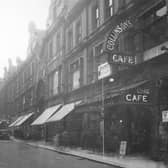 A view looking west along King Edward Street from Vicar Lane in May 1930. Collinson's Cafe, Stephenson's & Co drapers and Cross Arcade are shown in the background. S.N Kilner jewellers, Victoria furnishing & A.G Spalding athletic goods manufacturers are visible further along King Edward Street. 
