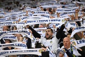 Leeds United fans hold up scarfs in the stands prior to the Sky Bet Championship Play-Off Semi-Final 2nd Leg match between Leeds United and Norwich City at Elland Road on May 16, 2024 in Leeds, England. (Photo by Michael Regan/Getty Images)