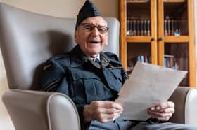 D-Day veteran Bernard Morgan reads historic note revealing end of WW2 in Europe.
