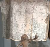 The photo is of a Waddingtons handkerchief map on display at Leeds City Museum. It shows the Mediterranean area including Algeria and Libya (which is shown as Italian territory) and is part of a set covering North Africa.