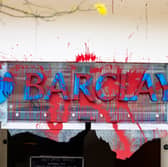 All the windows of the Barclays Bank branch in the centre of Bristol have been smashed and graffiti sprayed over them in a co-ordinated attack by a group targeting the bank. 
