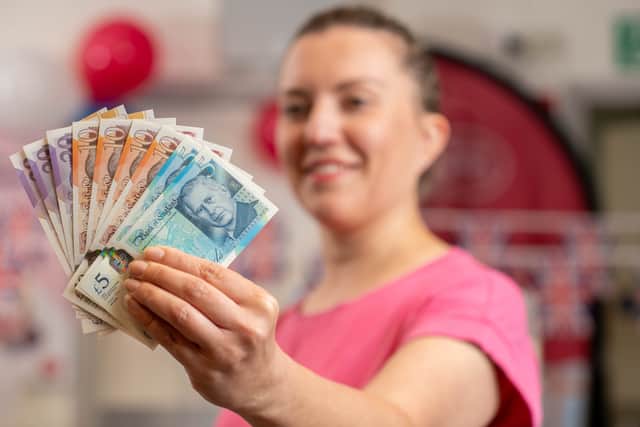 London tourist Paula Cavelius with the new-look banknotes bearing a portrait of King Charles III (Photo: Jas Lehal/PA Media Assignments)