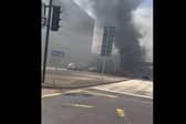 Thick plumes of black smoke covered the area after the car caught fire -Credit:Rick Bache/Facebook