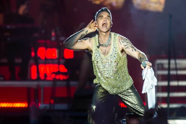 Robbie Williams is set for his only UK performance in 2024 as he headlines BST Hyde Park in July 2024. Are there still tickets to see the former Take That great in London though? (Credit: Tim Kildeborg Jensen / Ritzau Scanpix / AFP)