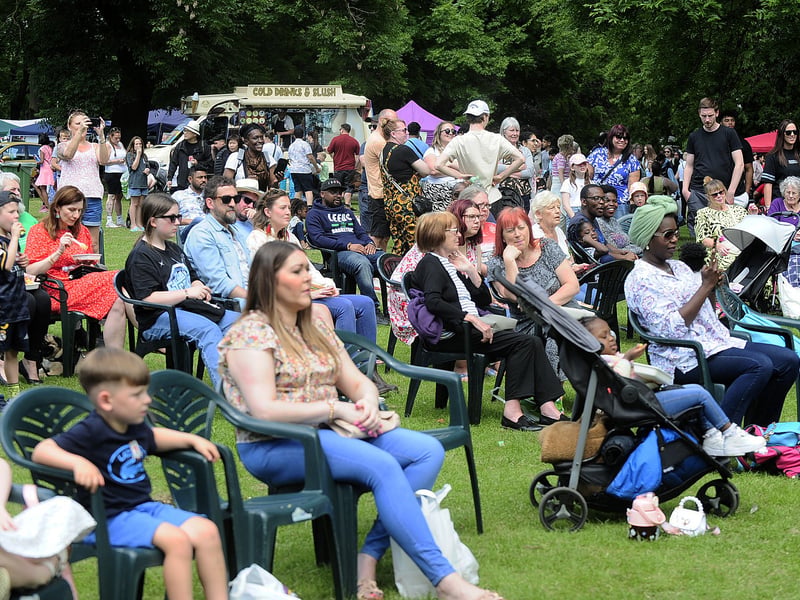 A large crowd watch the performers on stage.