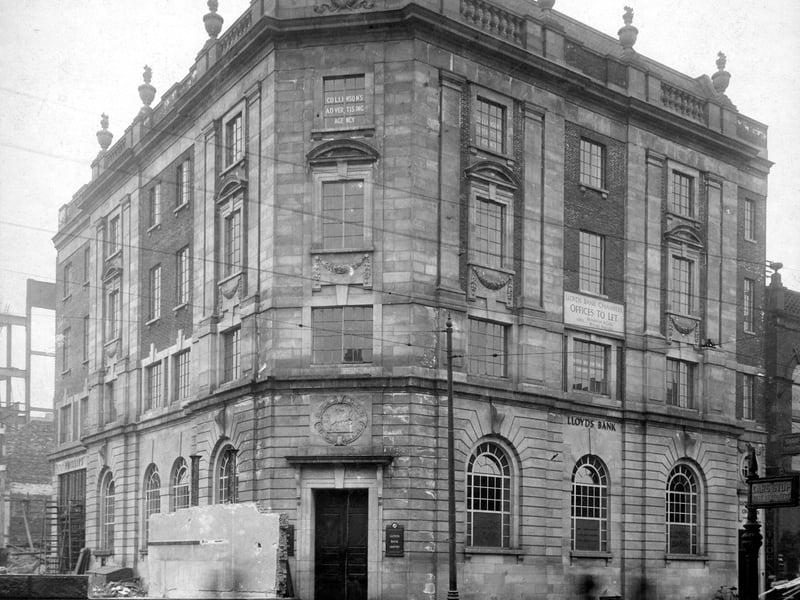 Lloyds Bank on junction of Vicar Lane with Headrow, taken during road widening. Phillip's Jewellers can be seen on the left. Pictured in July 1931.