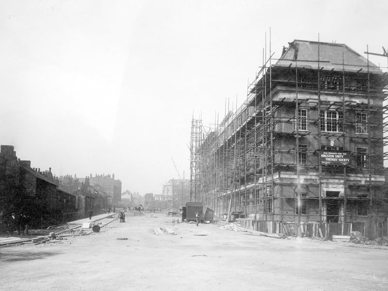 Eastgate under construction in September 1931. This road was built as part of Sir Reginald Blomfield's scheme of street widening and improvement and followed on from the widening of The Headrow with the Bus Station, Quarry Hill and the old Regent Street/Mabgate roundabout and was built on the site of Virginia Street and Pollard's Yard. The view looks west towards The Headrow and shows scaffolding around the building on the right which was to be the premises of the Kingston Unity Friendly Society.
