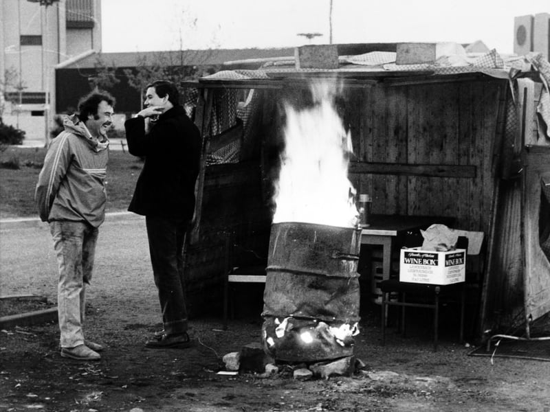 A lonely vigil for the pickets at Wistow Mine in May 1984 they man the gateway in the early hours. A blazing brazier keeps away the morning chill.