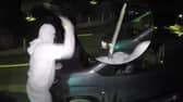 Nathan Smith, 33, has been jailed for 5 years. Here he is smashing the windscreen of a vehicle, while wearing a balaclava, gloves and brandishing a machete.