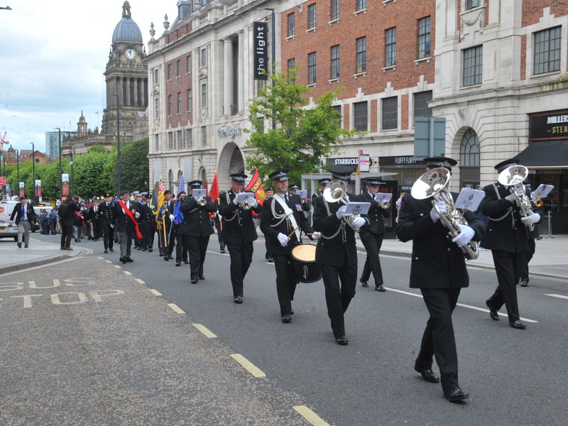 The West Yorkshire Police Band leads the march.