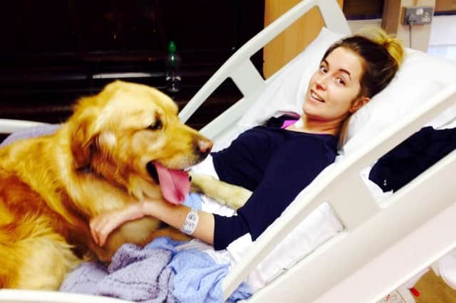 Jenna Fitzgerald with her golden retriever Cooper.