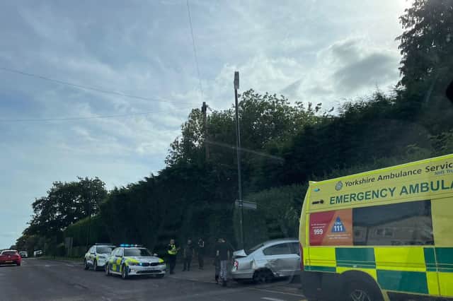 Emergency vehicles rushed to a car crash on Wetherby Road near East Keswick today.