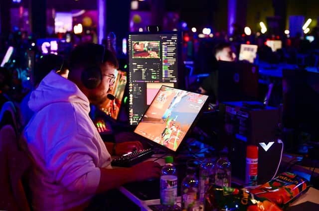 A gamer plays a video game during a Gamescom event. Photo: INA FASSBENDER/AFP via Getty Images