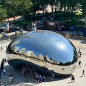 Chicago cityscape reflected in iconic Cloud Gate monument, known as 'The Bean'