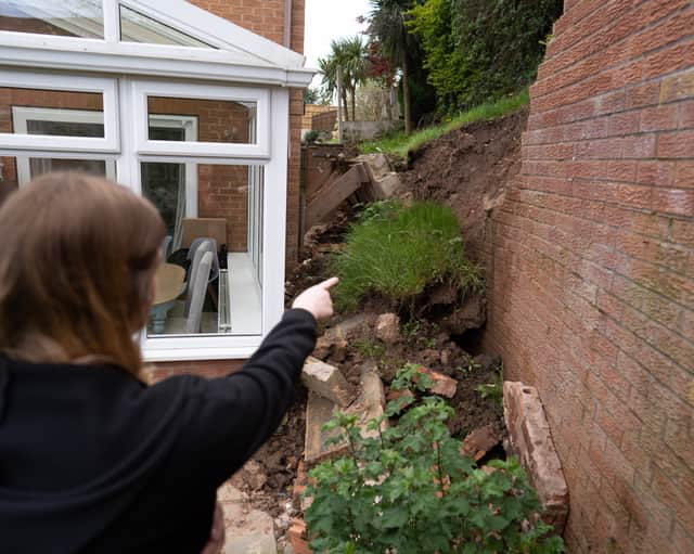 Lucy Gawthorpe at her home where a wall has collapsed.