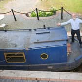 Stephen Cuddy with the mini canal lock he built to house a narrowboat turned into a swimming pool.