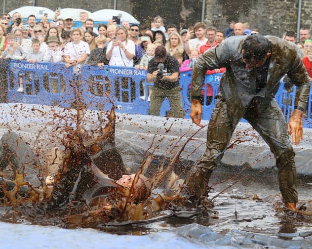 Hundreds of revellers descended on a pub garden to watch the 'world gravy wrestling championships.' 